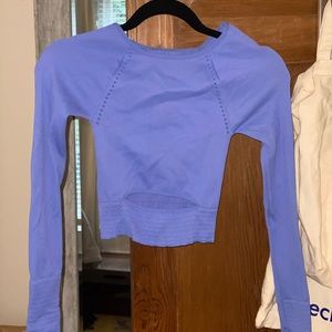 Free People blue workout top with keyhole in front at the bottom